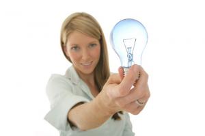 Girl holding light bulb